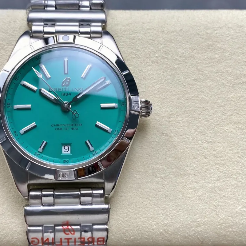 Breitling Chronomat Women's A103801A1L1A1 Replica - Turquoise Dial Fluted Bezel